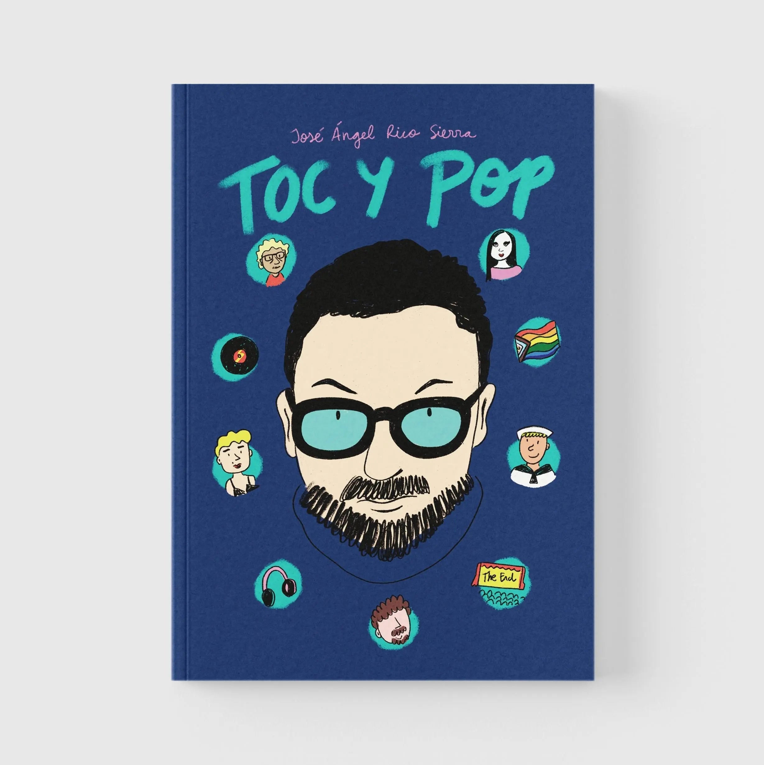 Un libro azul con el título "Toc y Pop" y una ilustración de un hombre con gafas.