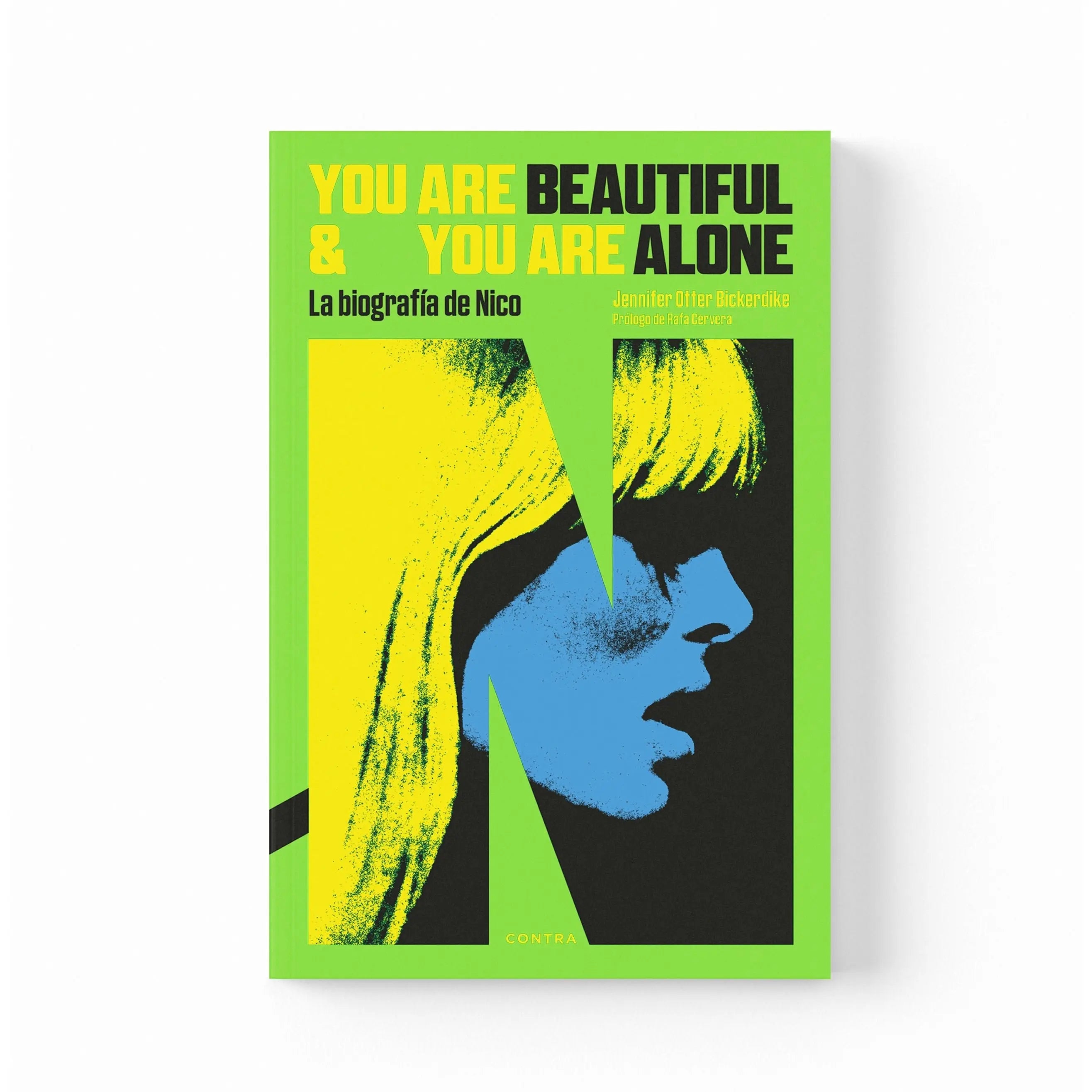 Libro "You Are Beautiful and You Are Alone" con una ilustración de Nico en verde y amarillo.