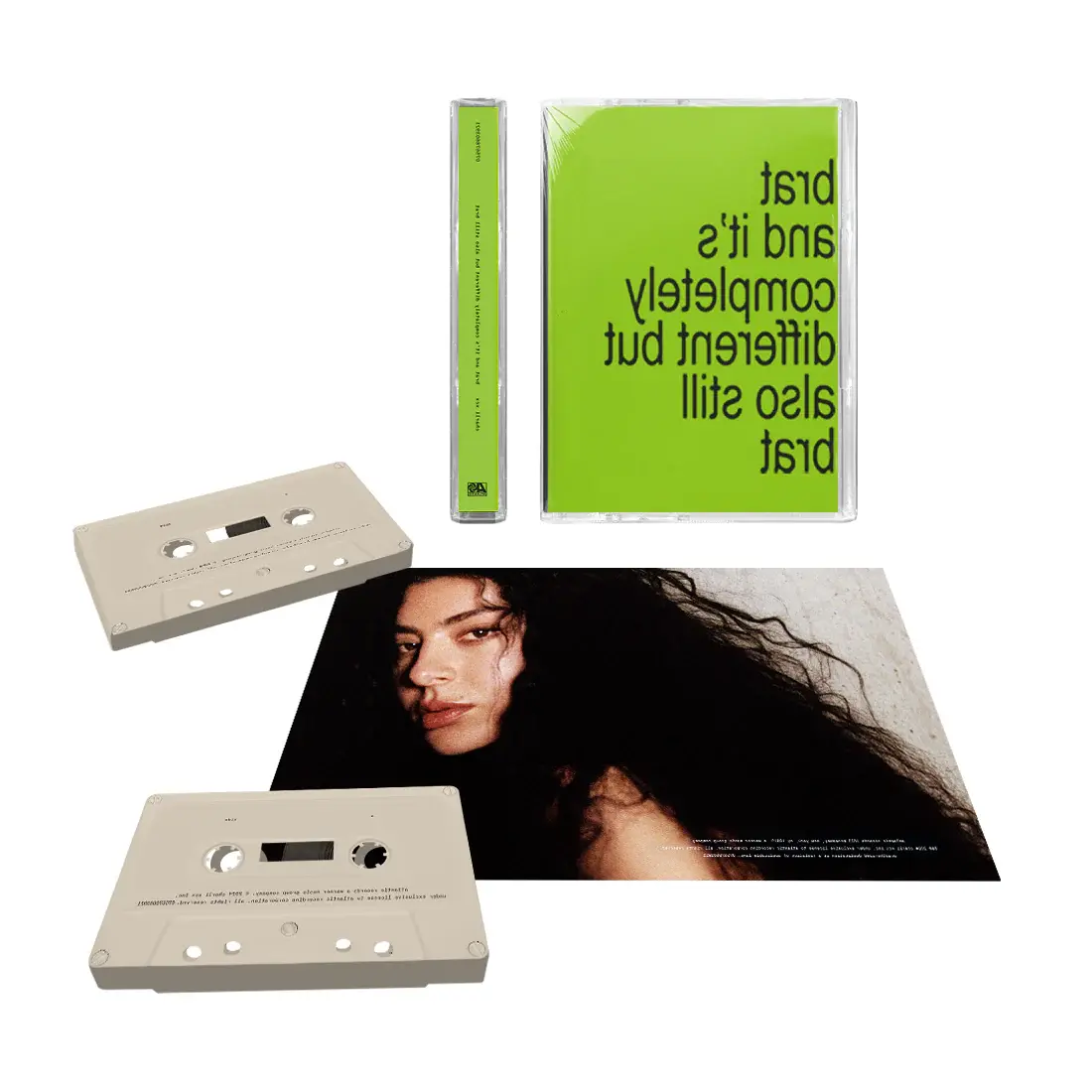 Two beige cassette tapes and a green cassette case with black text are displayed with a photo of Charli XCX.
