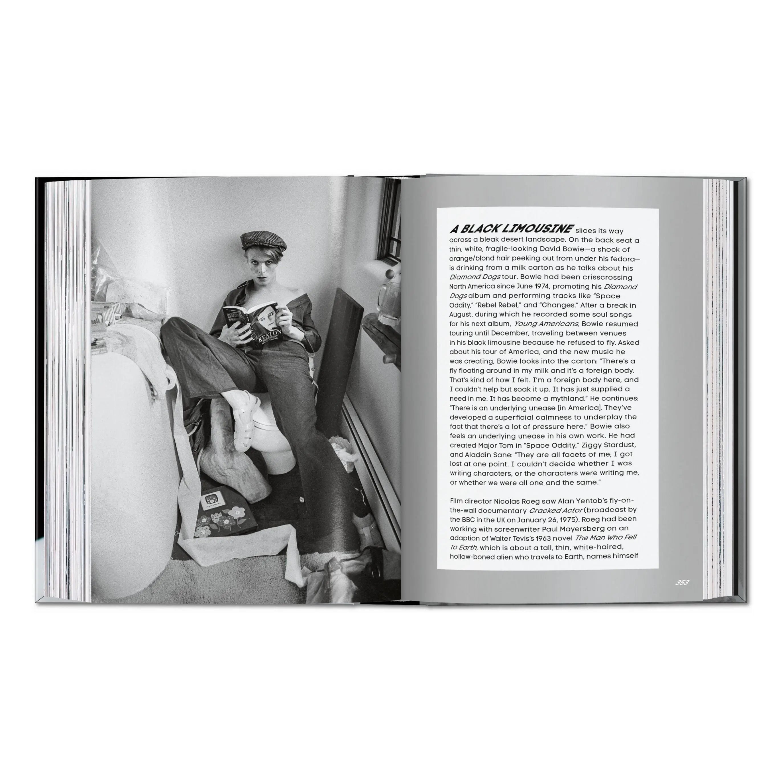 A book open to a black and white photo of David Bowie reading, with text on the right page.