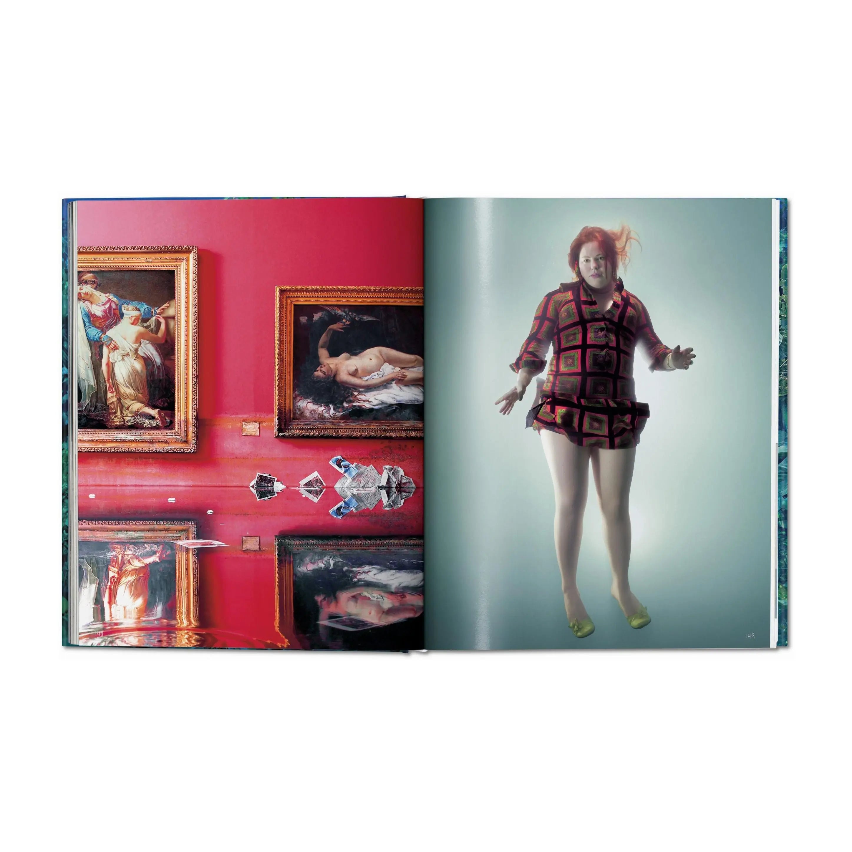 An open book displays a red room with paintings and a woman floating in water.