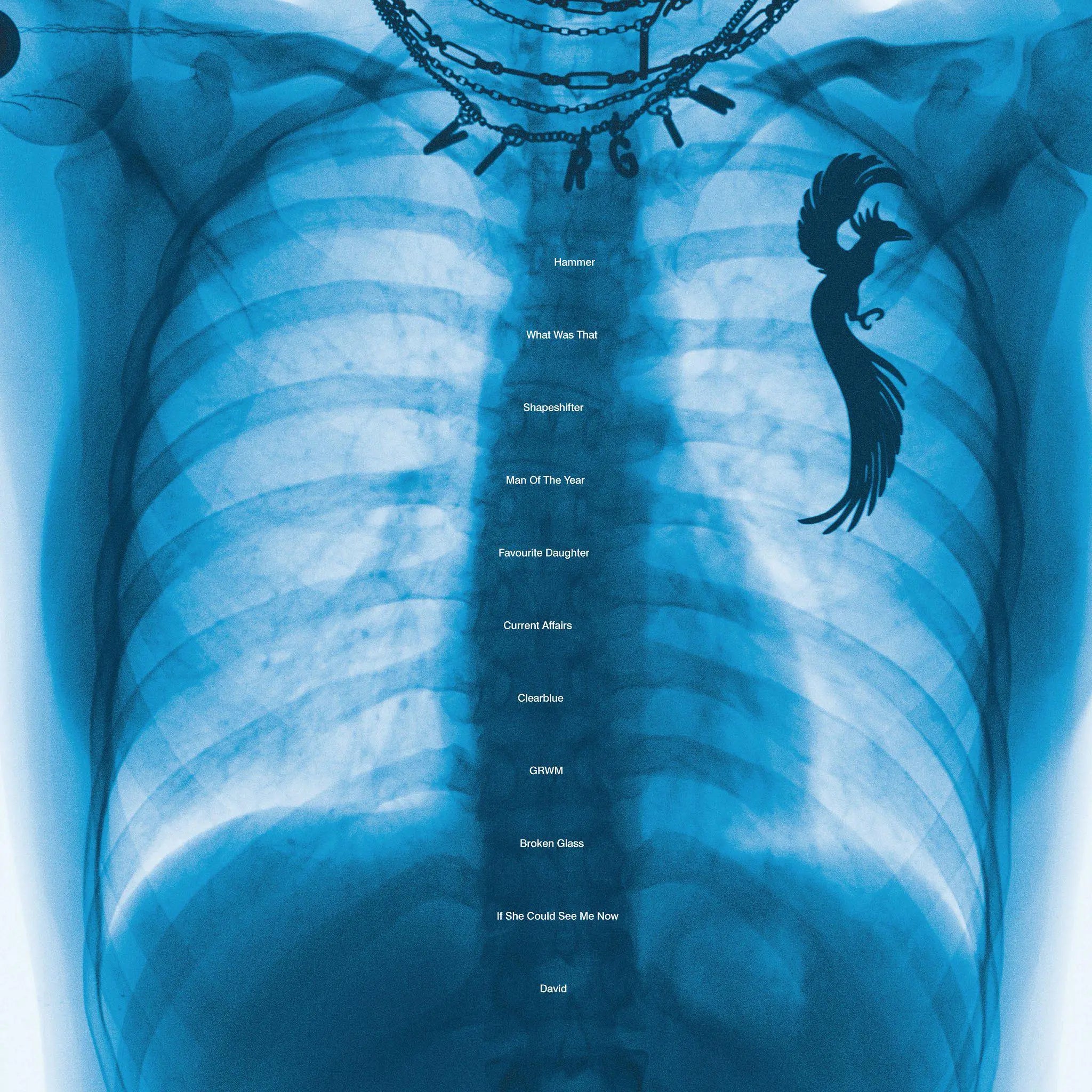 An X-ray image of a torso with a chain necklace and a phoenix tattoo, listing song titles.