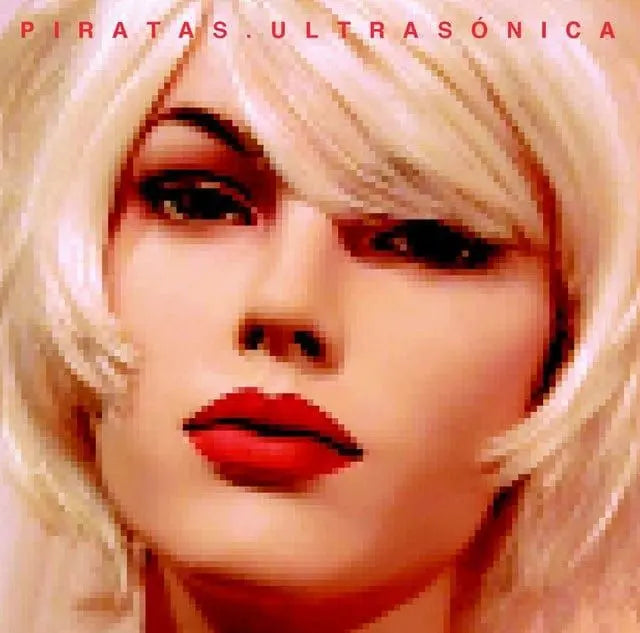 Close-up of a mannequin's face with blonde hair and red lipstick.