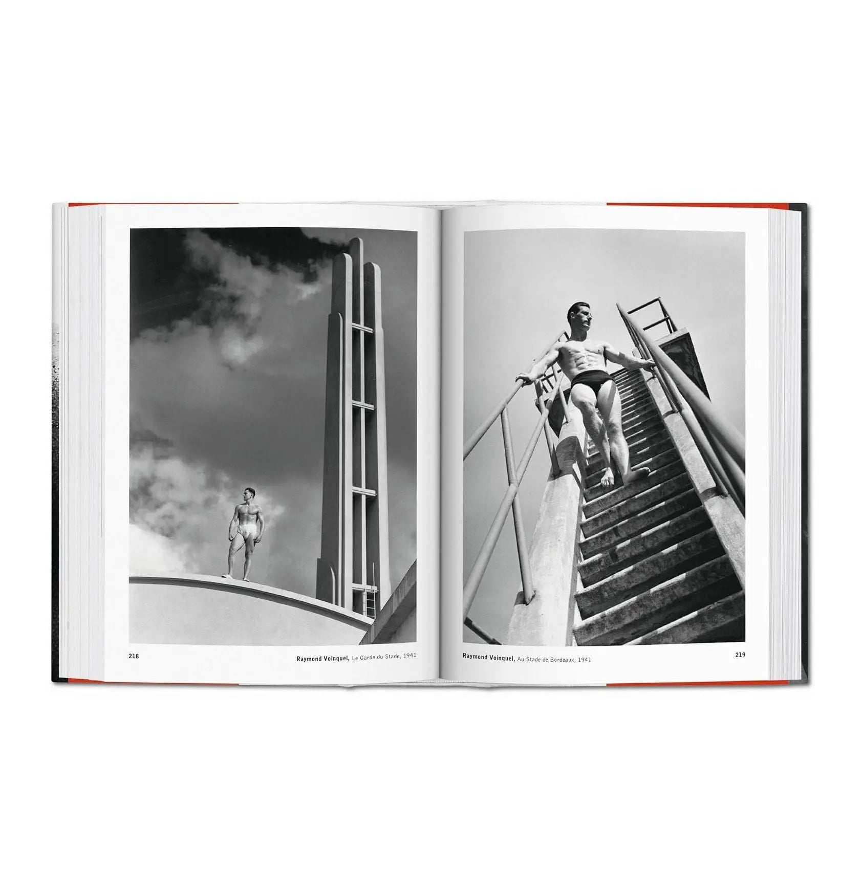 An open book displays two black and white photos of men in swim briefs.