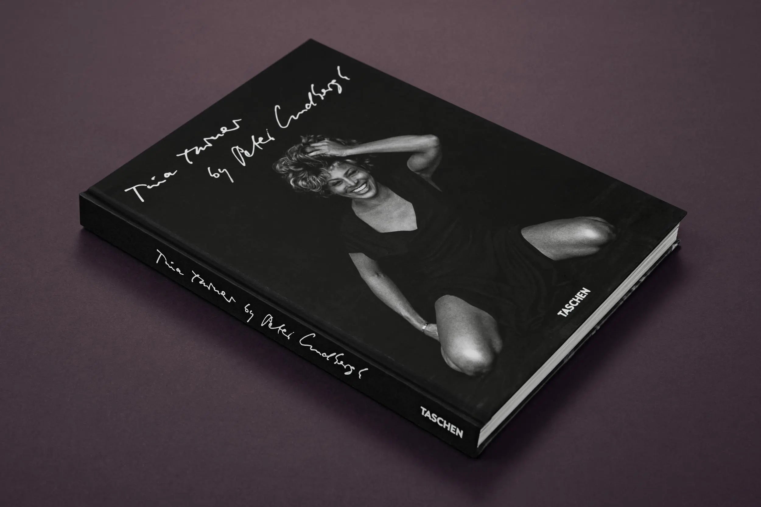 Tina Turner by Peter Lindbergh book, black cover with a smiling photo of Tina Turner.